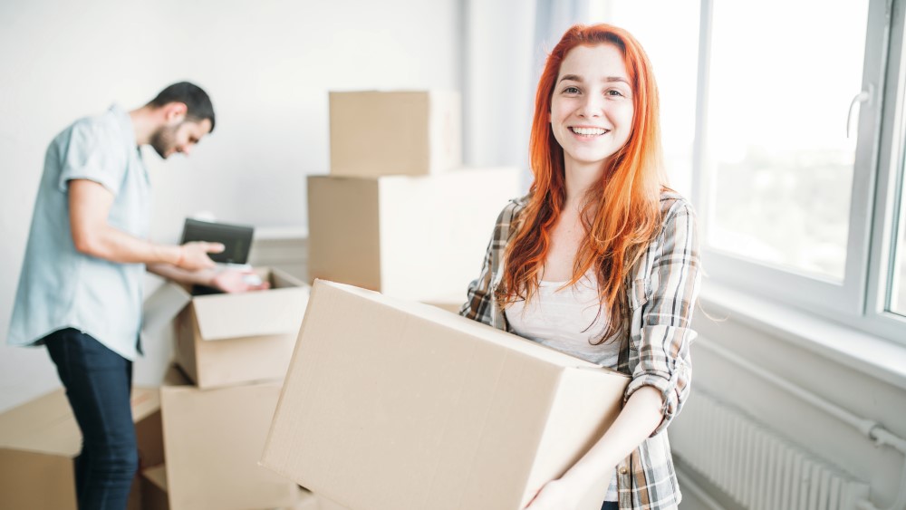 Happy couple moving to new house